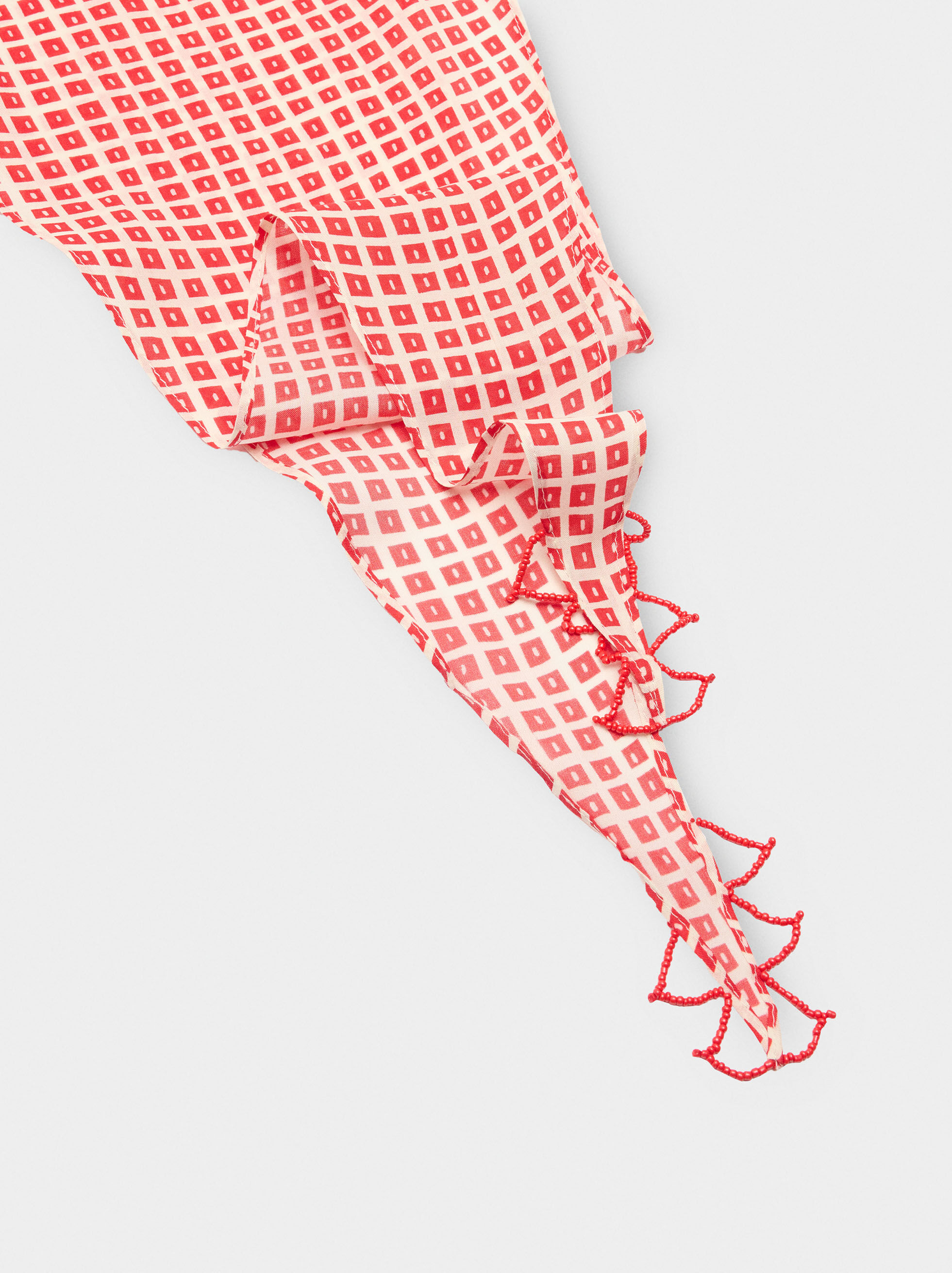 Printed triangular scarf with beads