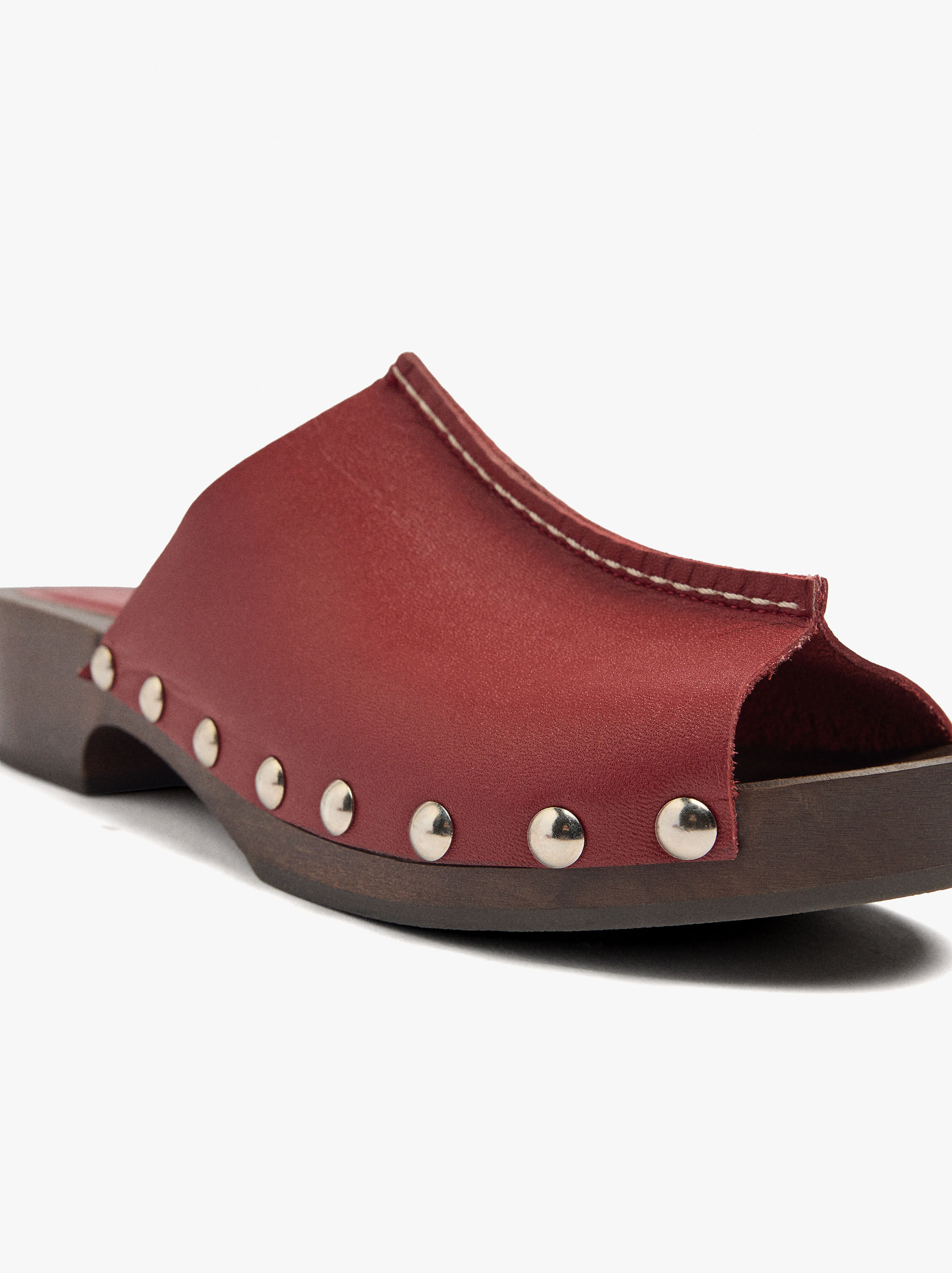 Leather mules with metal studs