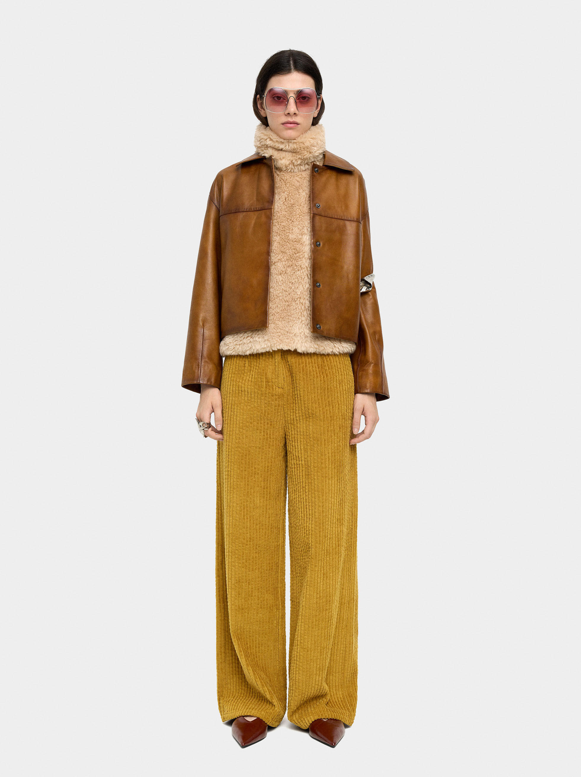 Faux fur coat with visible stitching